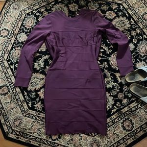 Large deep purple Herve Leger fitted dress.